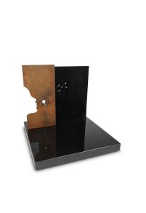 Urnengrabmal „Loslassen“ mit Silhouette und Pusteblum aus granit und Cortenstahl